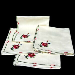 Vintage set of 4 cotton napkins with hand cross-stitched rose and edgings